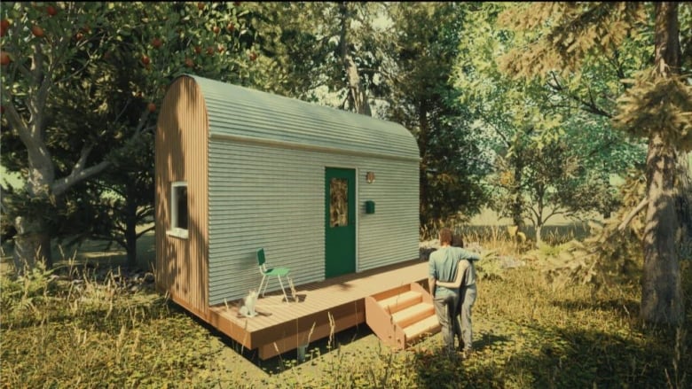 The design shows a couple standing in front of the micro home which is placed in a forested area. 