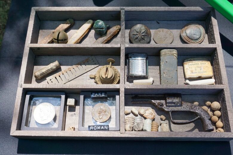 A wooden tray with various objects