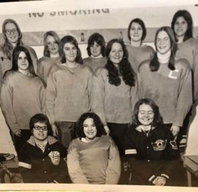 A black and white photo of girls