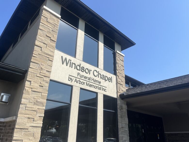 A picture of the front sign of a funeral home that says 'Windsor Chapel Funeral Home by Arbor Memorial Inc.'