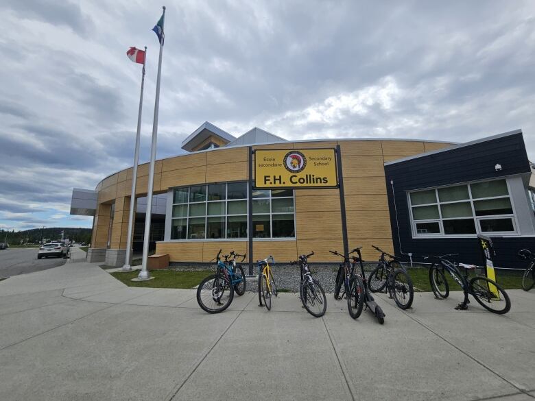 Entrance to F. H. Collins, bicycles locked outside, parking lots full. 