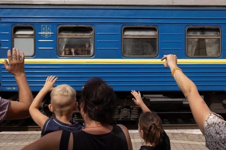 People bid farewell to relatives as they flee on an evacuation train from Russian troop advances in Pokrovsk, Ukraine, amid Russia's attack on Ukraine, August 22, 2024. 