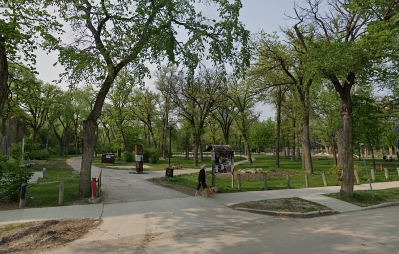 The entrance to a park is seen from the street