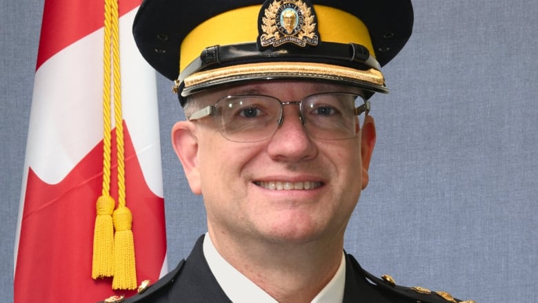 Portrait photo of a male RCMP officer in uniform.