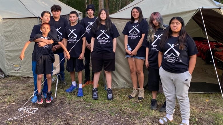 Youth standing together for a photo. 