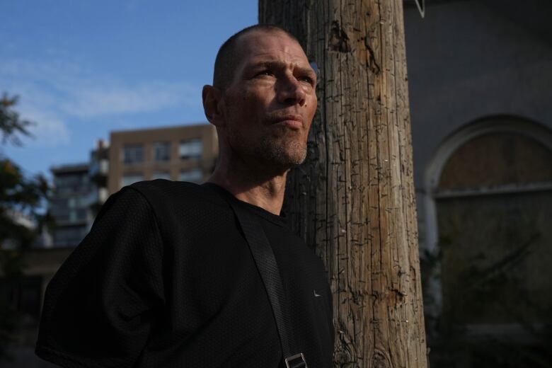 Justin Smith  is photographed near  Toronto's Parkdale Queen West Community Health Centre, on Friday, August 23, 2024.