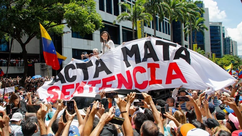 Opposition leader Maria Corina Machado leads a protest against the reelection of President Nicols Maduro one month after the disputed presidential vote in Caracas, Venezuela on Wednesday, Aug. 28, 2024.