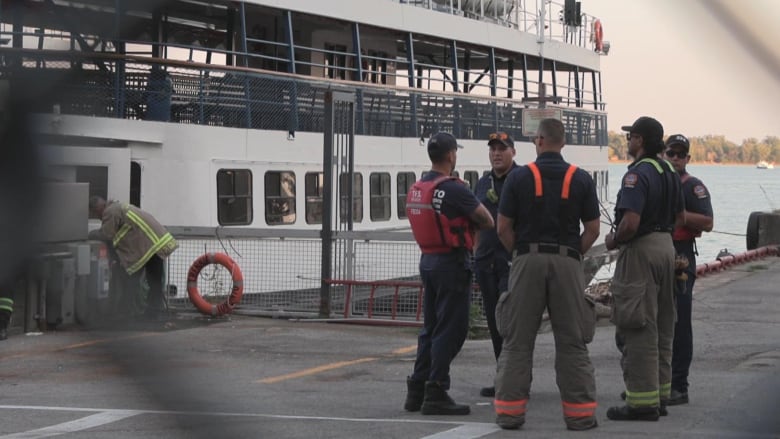 Emergency services on the dock at the Jack Layton Ferry Terminal in Toronto on Sept. 5, 2024. In the background is the William Inglis ferry.