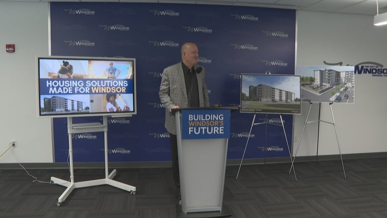 A man stands at a podium.