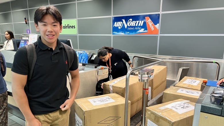 Cameron Lee checks in the hockey gear he brought north to Whitehorse. It was donated to his charity Support for Sport by the Vancouver Canucks