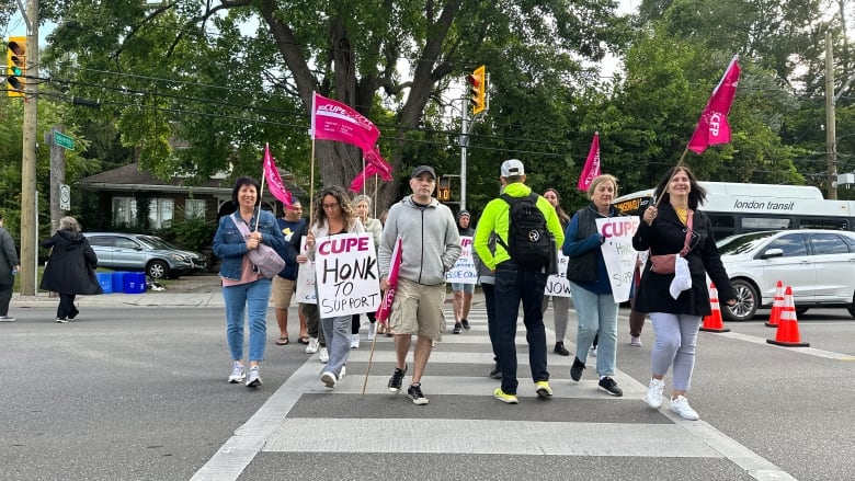 Facilities employees belonging to CUPE 2361 protest on Richmond Street, at University Drive on Monday Aug. 9, 2024. 