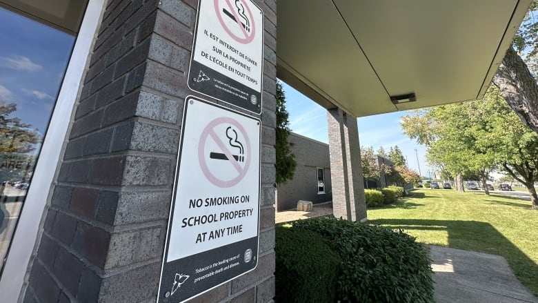 No smoking signs say, 'no smoking on school property at anytime.' 