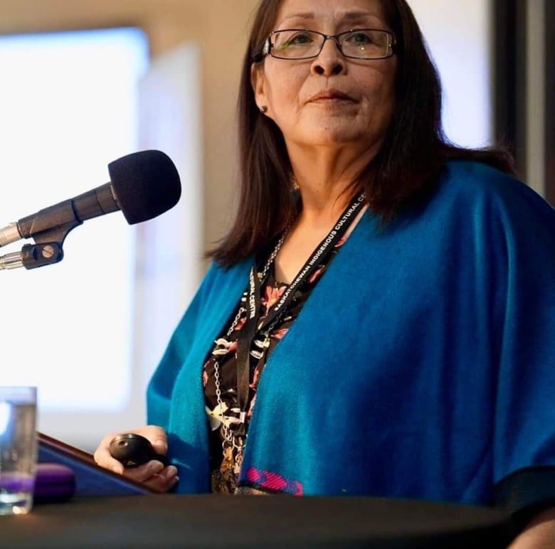 A woman standing at a podium 