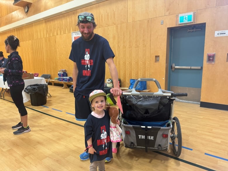 Dad and daughter in Terry Fox Run shirts