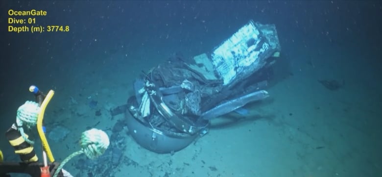 A smashed piece of Titan submersible on ocean floor.