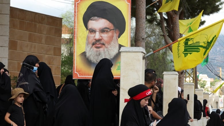 An image of Hezbollah leader Hassan Nasrallah is seen during the funeral of Hezbollah member Ali Mohamed Chalbi.