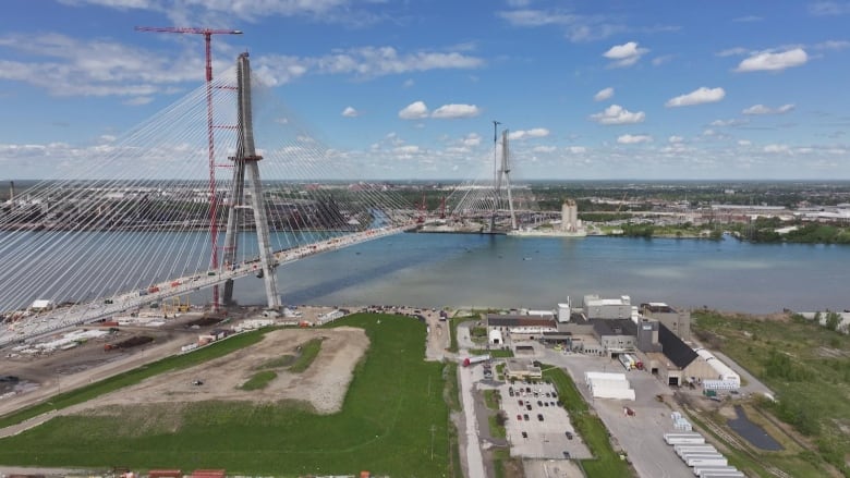 A shot shows a birds-eye-view shot of a bridge being built.