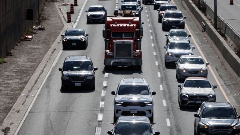 Commuters make their way through rush hour traffic on April 15, 2024  the first day of a planned three-year-long lane reduction on the Gardiner Expressway.