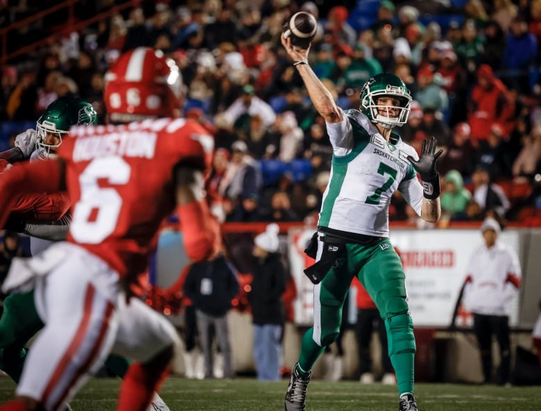 trevor harris is throwing the ball and a calgary player is in view running towards that direction