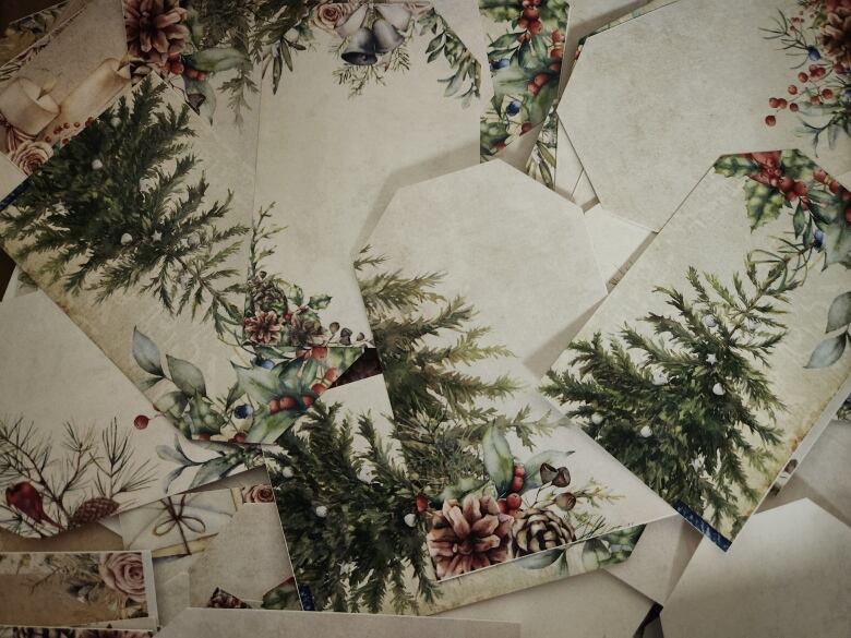 A table covered in Christmas tree envelopes