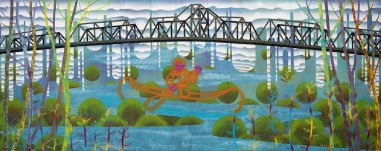 A mural of a person canoeing on a body of water. 