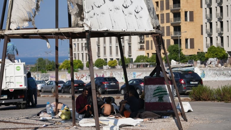 Displaced people in Beirut seek shelter.