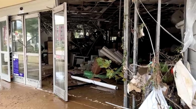 A destroyed business, its front windows are gone due to Hurricane Helene.