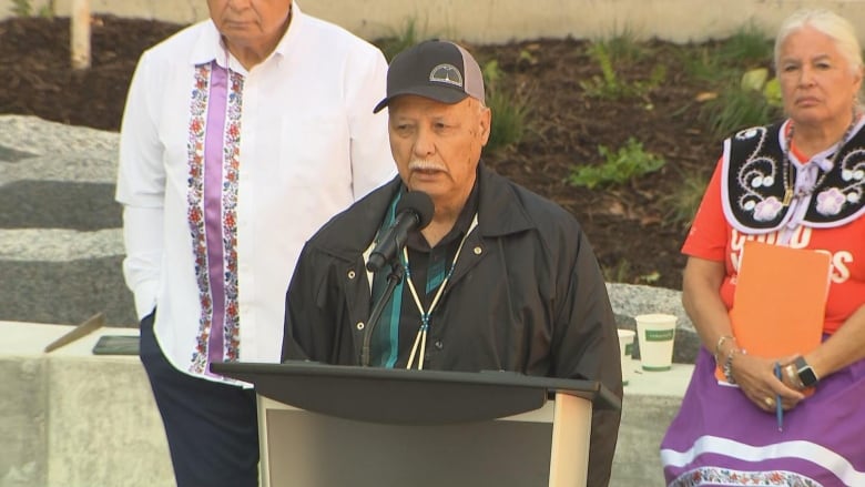 Man in hat giving speech