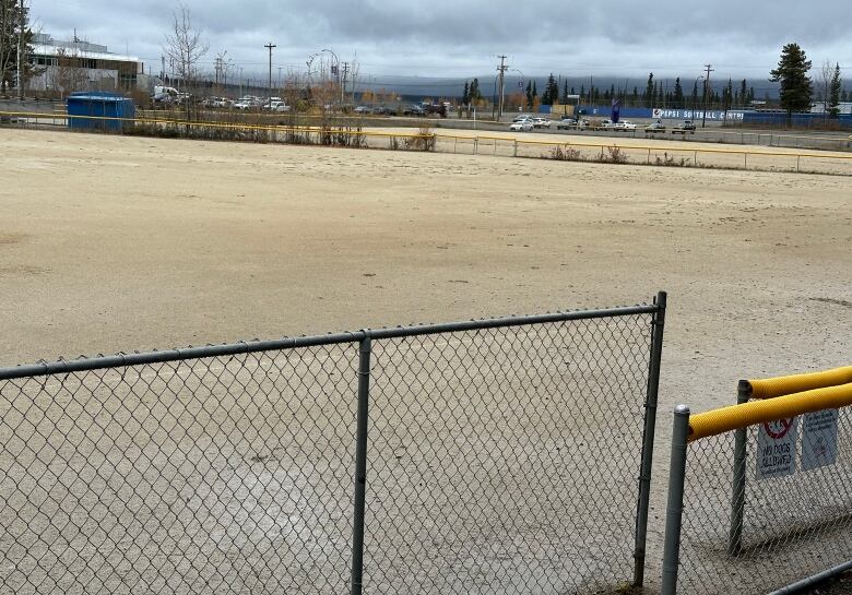 Looking out at a softball field.