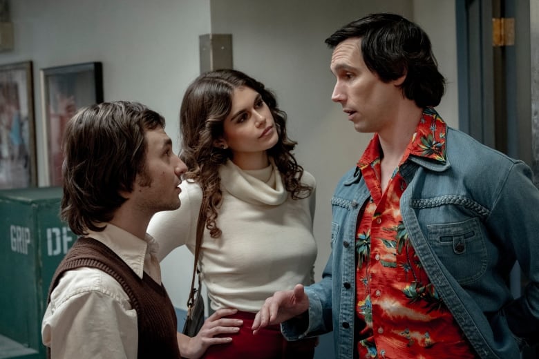 This image released by Sony Pictures shows Gabriel LaBelle as Lorne Michaels, left, Kaia Gerber as Jacqueline Carlin, center, and Cory Michael Smith as Chevy Chase in a scene from 