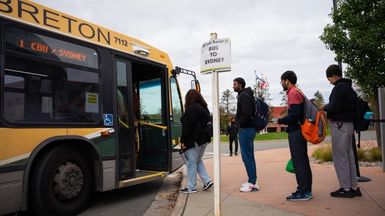 Cape Breton University students board the bus after class in Sydney, N.S., Wednesday, Oct. 18, 2023.