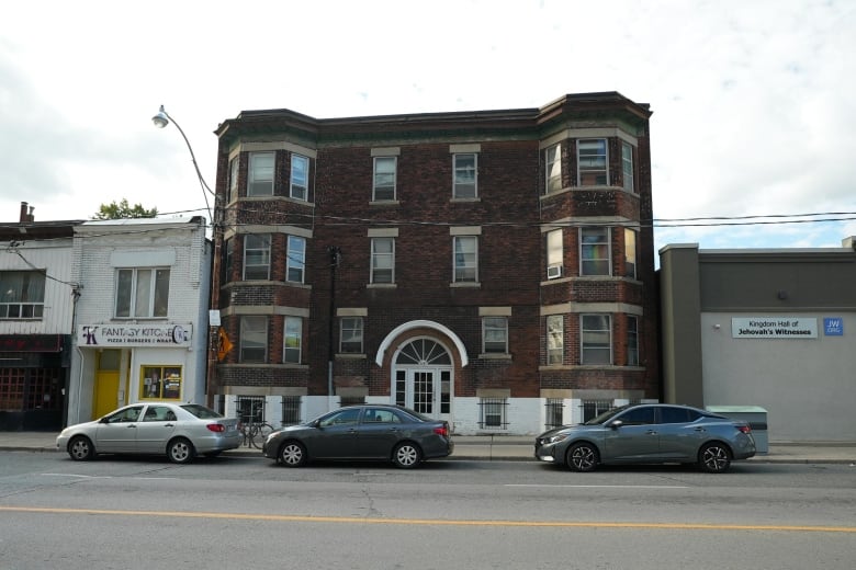 A small brick apartment building.