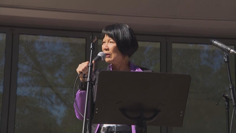 Woman making a speech outdoors