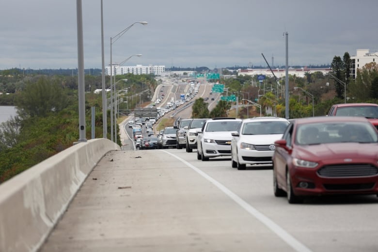 Heavy traffic snaking its way along a highway.