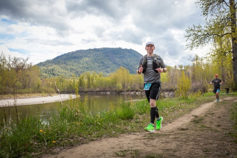 Man runs along a river