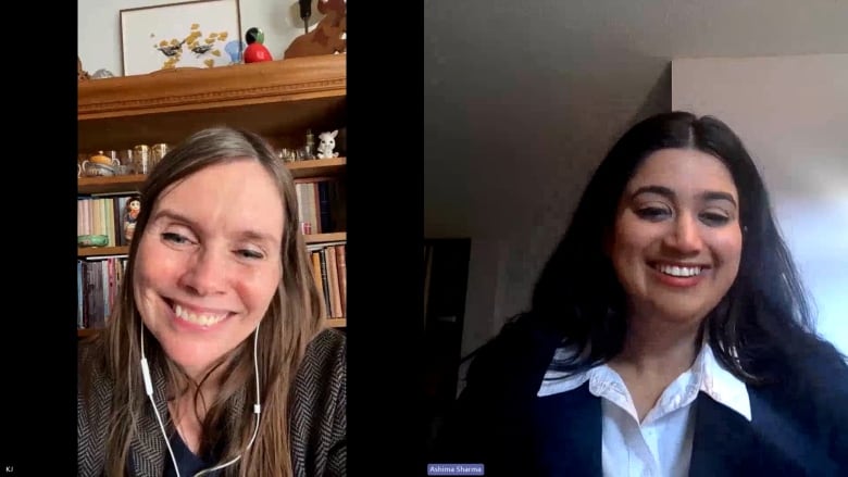 Two women smiling while in conversation in a videocall.