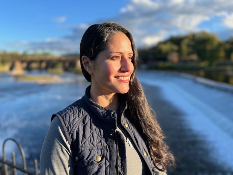 Woman next to river