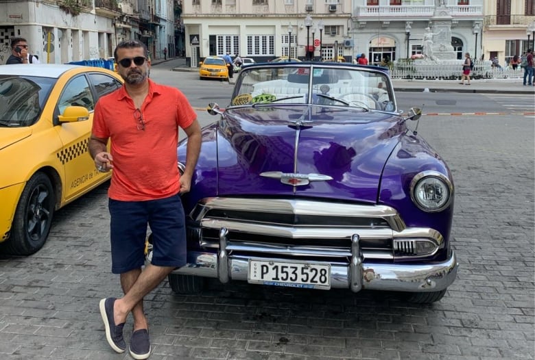 Man standing next to a car