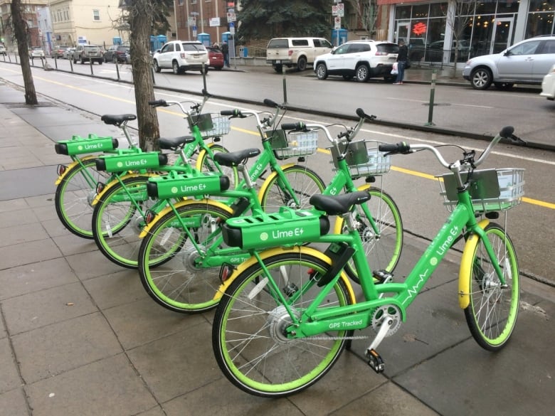 Five Lime bikes are seen.