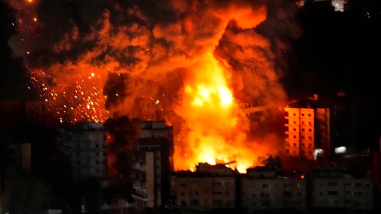 Flames and smoke rise after Israeli airstrikes in suburbs in southern Beirut, Lebanon.