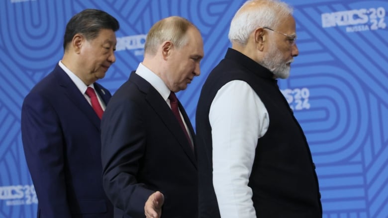 From left: Chinese President Xi Jinping, Russian President Vladimir Putin and Indian Prime Minister Narendra Modi attend a family photo ceremony prior to the BRICS Summit plenary session in Kazan, Russia, Wednesday, Oct. 23, 2024.