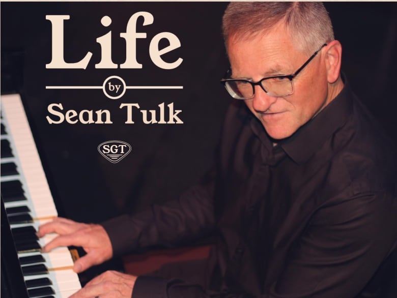 Man playing a piano with word Life by Sean Tulk in text.