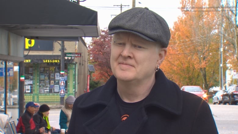 Portrait of a man in flat cap.