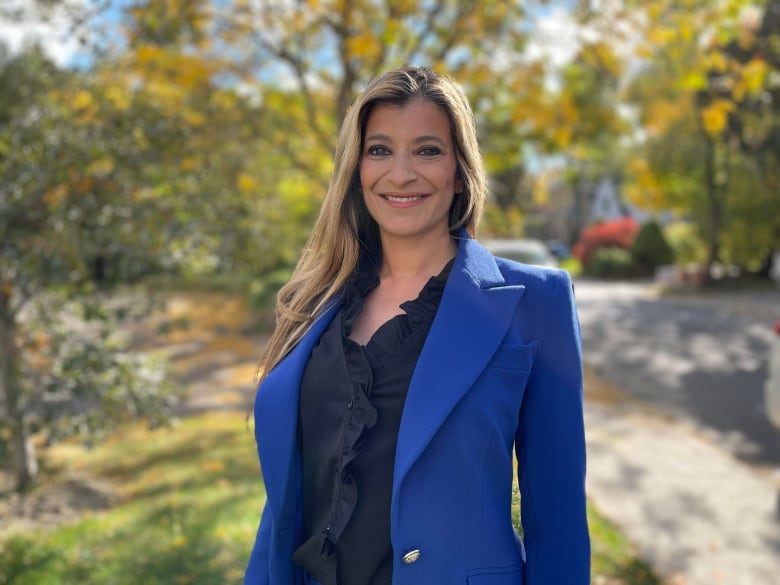 Photo of a woman outside in a blue blazer