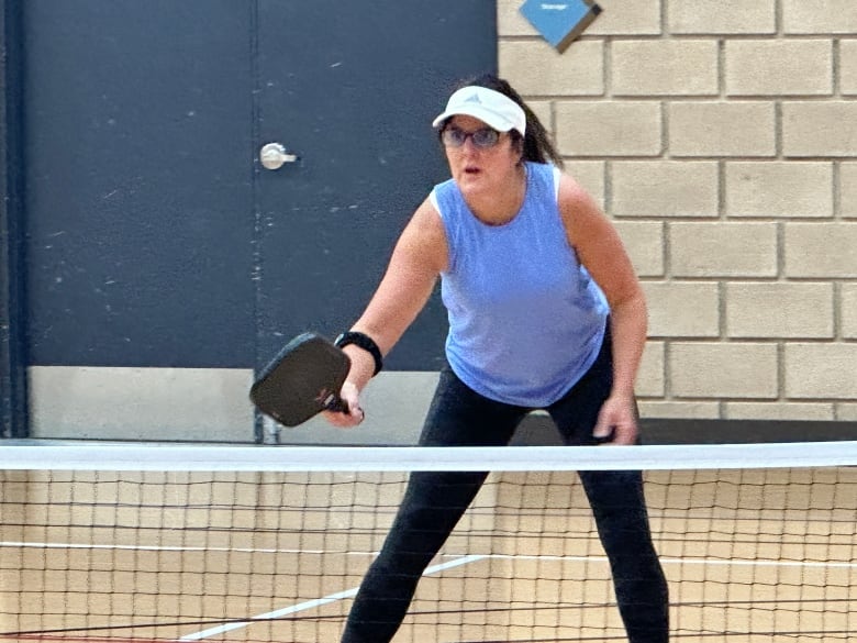 A woman with the Windsor Pickleball Club plays pickleball at the WFCU Centre