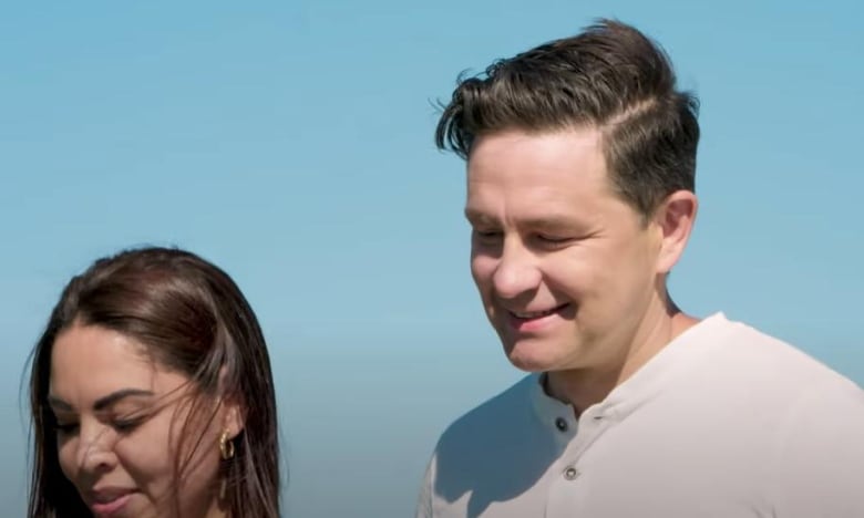 Conservative Leader Pierre Poilievre, right, is pictured in a Conservative Party ad with his wife, Ana, left.