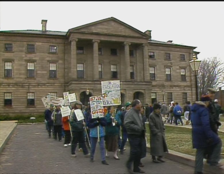 A protest outside province house in PEI in 1990 shown in a still from archival footage.