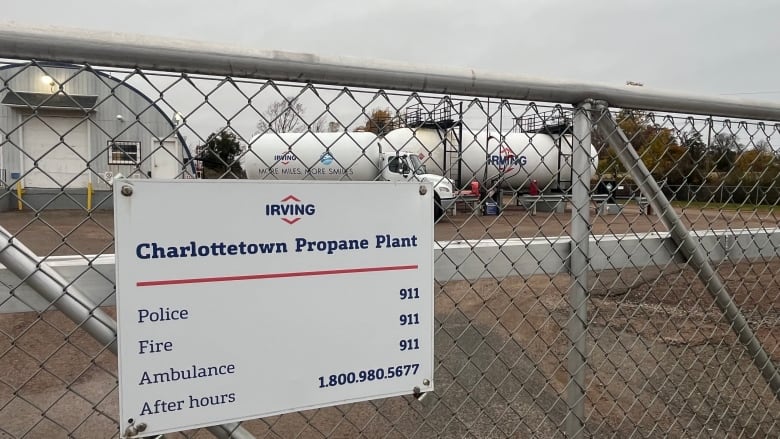 A sign hangs on a fence outside an Irving propane plant 