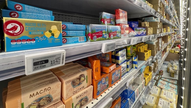 Packages of butter are seen on the shelves of a store in Moscow.