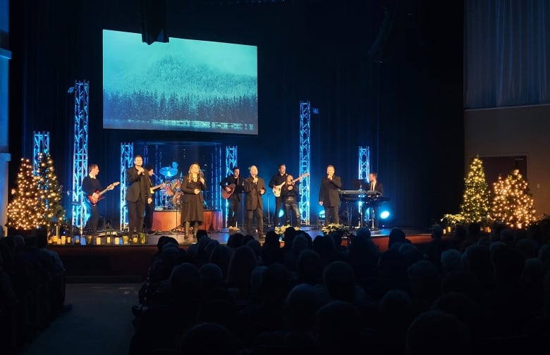 A group of people performing a stage